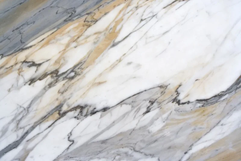 Close-up of white and beige marble with grey veins